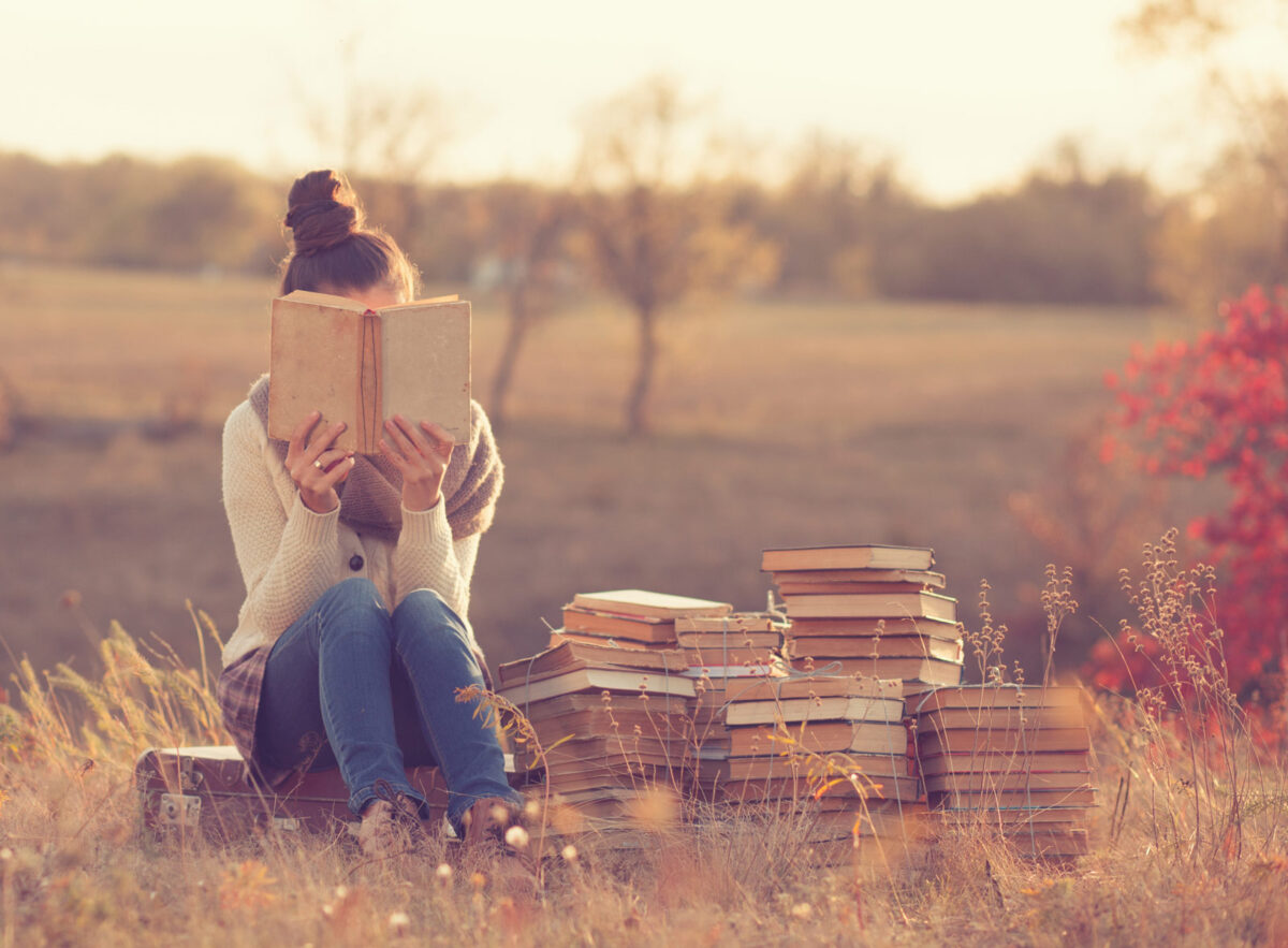 Woman with books - self care for introverts