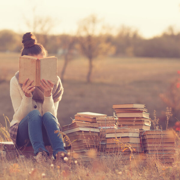 Woman with books - self care for introverts